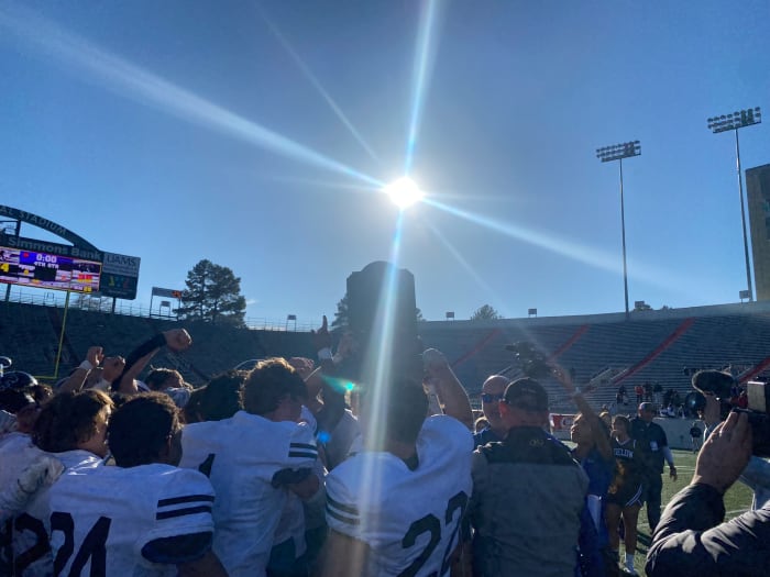 Bigelow accepts the Classa 2A state championship trophy. (Photo by Jeff Halpern)